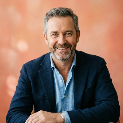 James Hollis, editor at deepcamai, in a warmly lit portrait